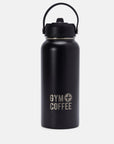 A black stainless steel water bottle with a Gym+Coffee logo, featuring a flip straw lid and carry handle.